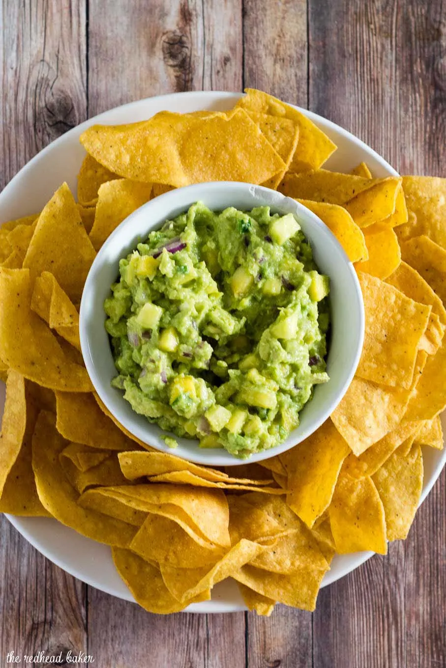 Tropical guacamole puts a sweet spin on a Mexican classic with the addition of pineapple and mango. Serve as a snack, appetizer or side dish!