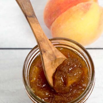 Peach vanilla jam sweetened with honey is canned using the waterbath method (no pectin needed!), so you can have a taste of summer all year long! 