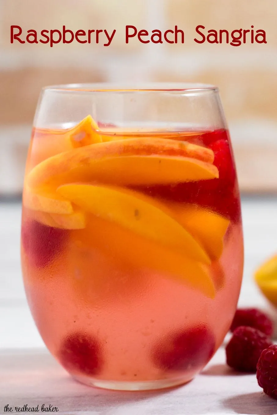 Fresh, sweet summer fruit balances dry white wine in this raspberry peach sangria. It's the perfect summer cocktail for any summer occasion.