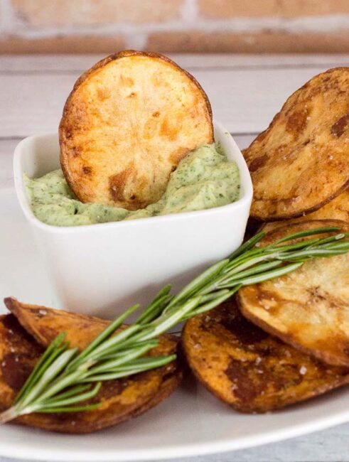 Rosemary potato chips: you can't get this flavor in a bag of store-bought chips! Dunk these crispy chips in a dip of fresh herb aioli for even more flavor. #ProgressiveEats