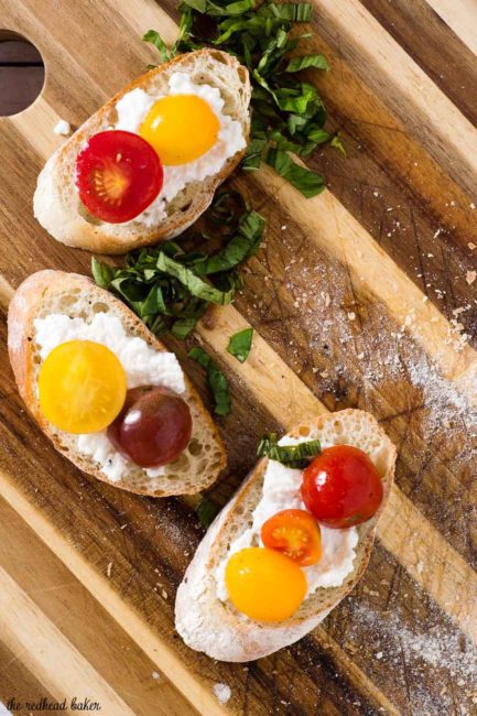 Bruschetta with marinated tomatoes and ricotta is an easy appetizer that epitomizes summer. Using multicolored cherry tomatoes adds visual interest. 