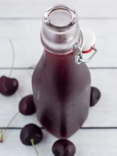 A cherry shrub is a fruit syrup preserved with vinegar, dating back to Colonial America. It can be used to make refreshing cocktails.
