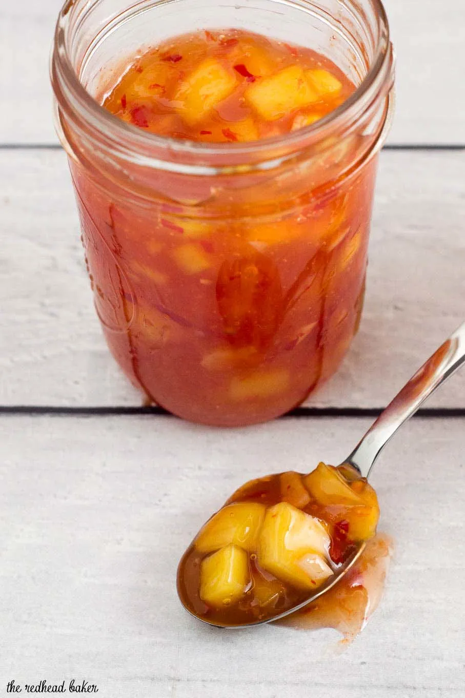 This sticky, sweet mango chili sauce is easy to make and so addictive! Use it to dip shrimp, chicken or fresh spring rolls. 