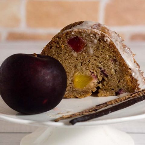 Flavorful vanilla bean bourbon plum bundt cake is flavored with plums mascerated in bourbon and sugar — it's the perfect way to end summer! #ProgressiveEats