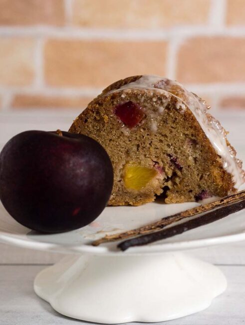 Flavorful vanilla bean bourbon plum bundt cake is flavored with plums mascerated in bourbon and sugar — it's the perfect way to end summer! #ProgressiveEats