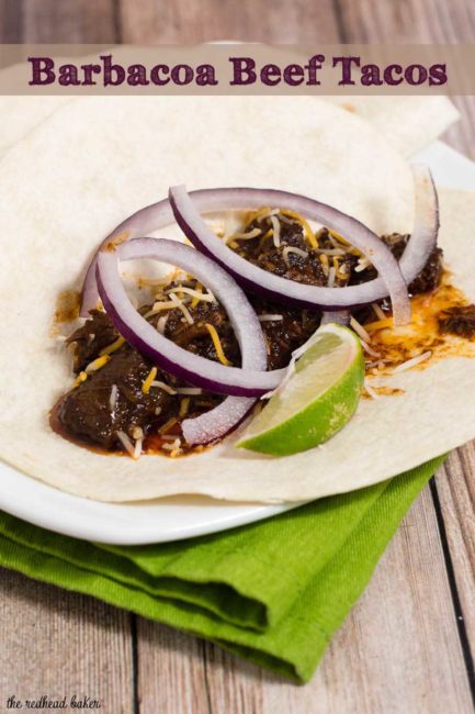 Authentic barbacoa beef tacos are piled with shredded beef cooked low and slow in chili-pepper spiced sauce, and topped with cilantro, salsa and lime wedges.