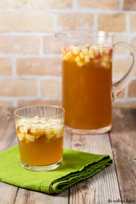 Cinnamon apple cider sangria is a delicious fall cocktail combining white wine, apple cider, apple brandy and cinnamon whiskey. #AppleWeek