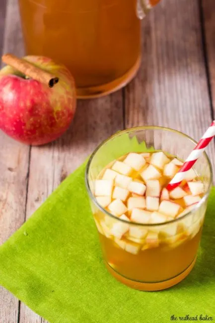 Cinnamon apple cider sangria is a delicious fall cocktail combining white wine, apple cider, apple brandy and cinnamon whiskey. #AppleWeek