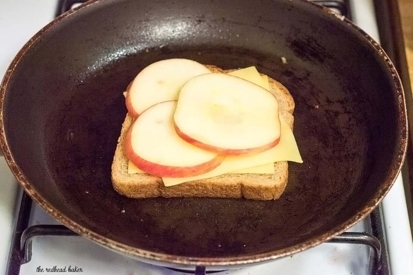 Thinly sliced honeycrisp apples add a sweet twist to classic grilled cheese. They are paired here with gouda, but cheddar would be delicious, too. #AppleWeek