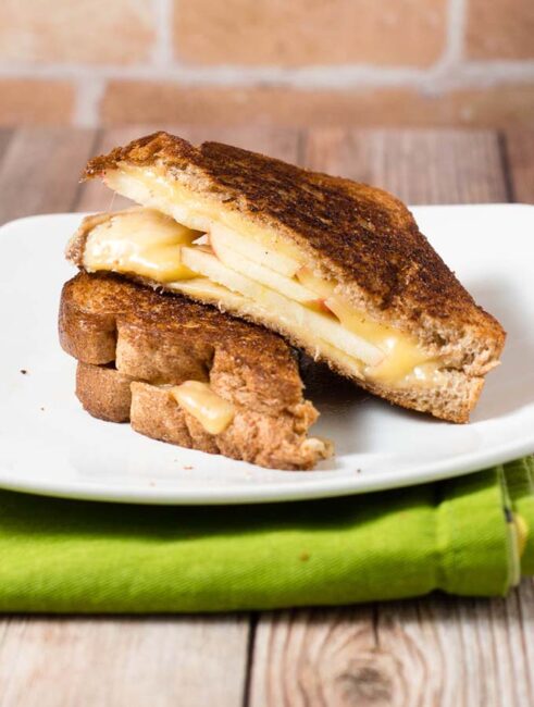 Thinly sliced honeycrisp apples add a sweet twist to classic grilled cheese. They are paired here with gouda, but cheddar would be delicious, too. #AppleWeek