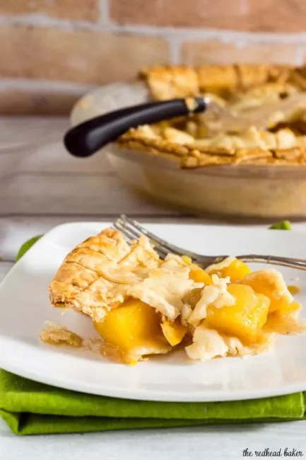 One slice of this mango peach pie is a tropical treat! Chunks of fresh fruit are lightly spiced with cinnamon, ginger and nutmeg.&nbsp; #OXOGoodCookies #BakeADifference