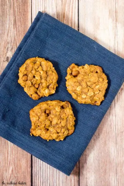 These chewy pumpkin oatmeal cookies are flavored with spices and nutty browned butter, and are loaded with caramel chips.&nbsp; #PumpkinWeek