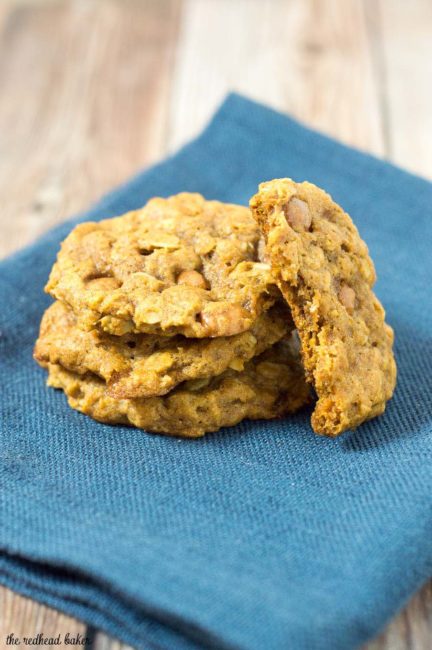 These chewy pumpkin oatmeal cookies are flavored with spices and nutty browned butter, and are loaded with caramel chips.  #PumpkinWeek