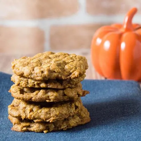 These chewy pumpkin oatmeal cookies are flavored with spices and nutty browned butter, and are loaded with caramel chips.  #PumpkinWeek