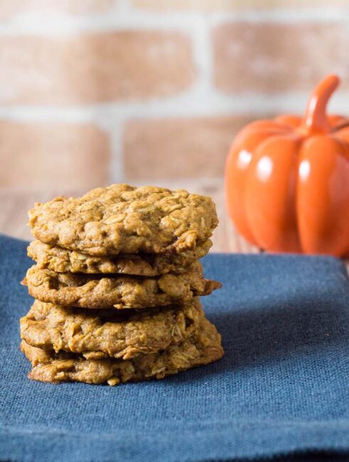 These chewy pumpkin oatmeal cookies are flavored with spices and nutty browned butter, and are loaded with caramel chips.  #PumpkinWeek