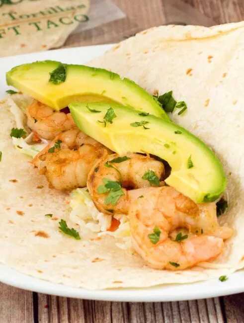 With a touch of avocado and pineapple slaw for some sweetness, these chipotle lime shrimp tacos are the perfect combination&nbsp;of spicy and fruity!