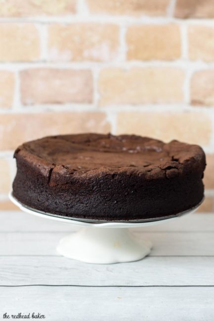 Naturally gluten-free flourless chocolate cake is rich, dense, and has intense chocolate flavor. Top with whipped cream, ice cream or fruit sauce. #Choctoberfest