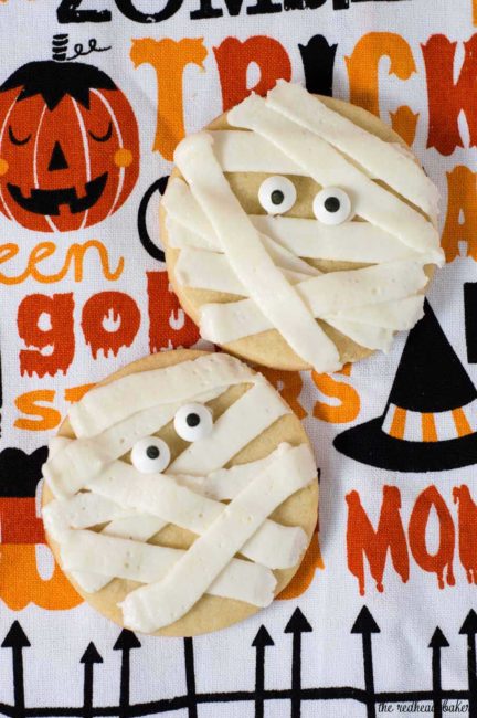 Scare up some easy Halloween treats — make these spooky mummy cookies. Simply pipe a few lines of frosting onto round sugar cookies, add candy eyes and you're done! #ProgressiveEats