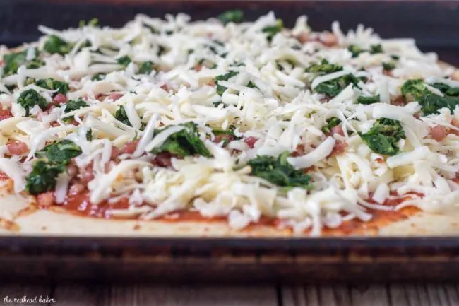 October is National Pizza Month, but this spinach, pancetta and fontina pizza can be enjoyed all year round.&nbsp;