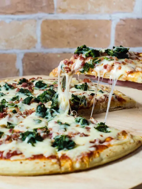 October is National Pizza Month, but this spinach, pancetta and fontina pizza can be enjoyed all year round. 