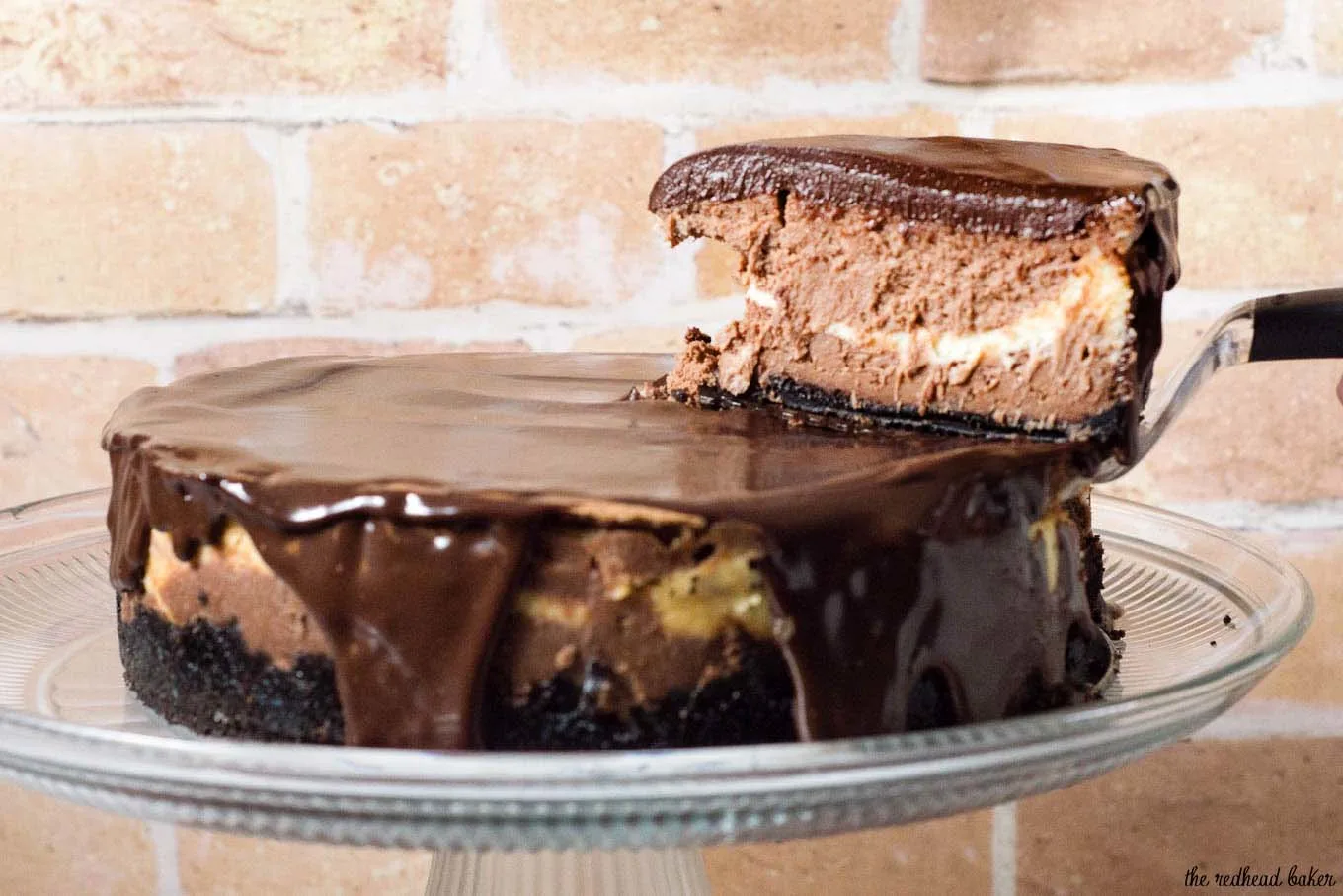 If chocolate cheesecake is good, triple chocolate cheesecake must be better! Layers of semisweet, white and milk chocolate cheesecake on a chocolate cookie crust are topped with a rich chocolate glaze. #Choctoberfest