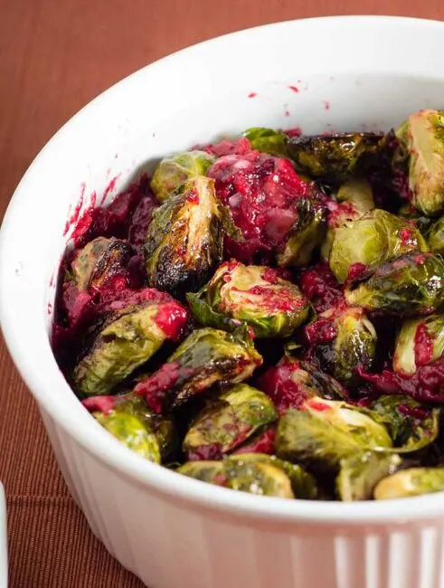 Roasted brussels sprouts are tender and sweet, and tossing them with a cranberry brown butter sauce adds a savory-sweet flavor.