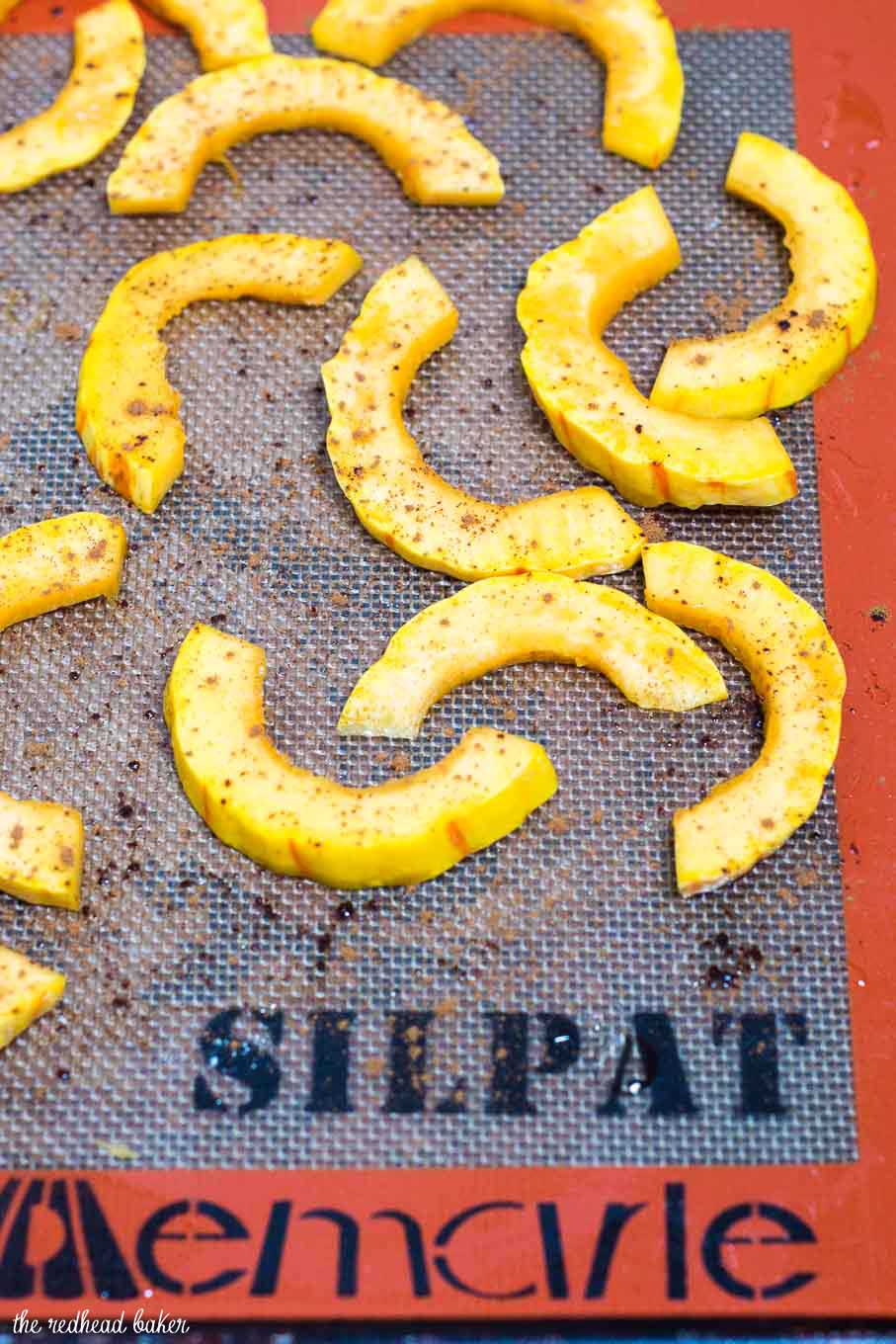 Delicata squash and apple stacks are a unique way to enjoy this fall produce. Seasoned with cinnamon and thyme, they blend sweet and savory flavors.