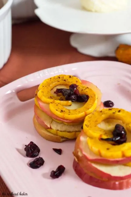 Delicata squash and apple stacks are a unique way to enjoy this fall produce. Seasoned with cinnamon and thyme, they blend sweet and savory flavors.