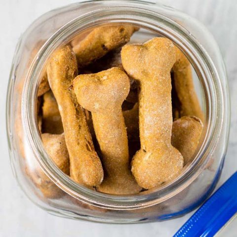 Pumpkin apple dog biscuits are a healthy, crunchy treat for your furry friend. Substitute almond flour for the wheat flour if your dog can't have grains.