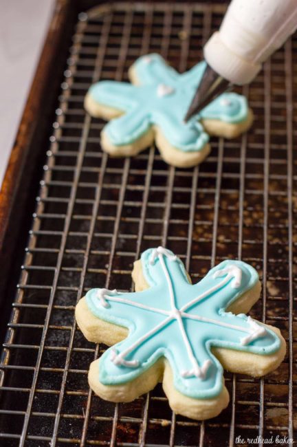 Let it snow with these adorable snowflake cookies! Perfect for any winter party, decorate each in a unique pattern, just like real snowflakes!  #ChristmasCookies