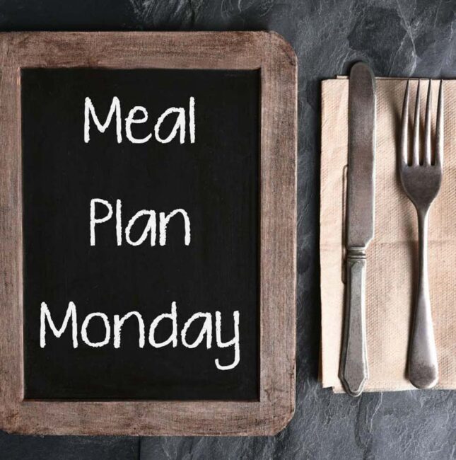 Chalkboard that says "Meal Plan Monday" next to a set of utensils