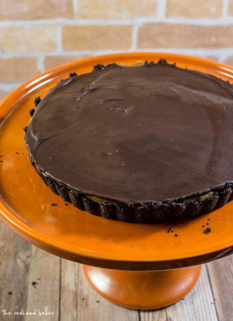 This decadent chocolate peanut butter tart has a sweet chocolate crust, a custardy peanut butter filling, and a rich chocolate glaze. It uses just a few ingredients, and requires almost no baking!