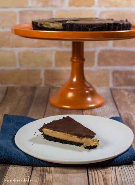 This decadent chocolate peanut butter tart has a sweet chocolate crust, a custardy peanut butter filling, and a rich chocolate glaze. It uses just a few ingredients, and requires almost no baking!
