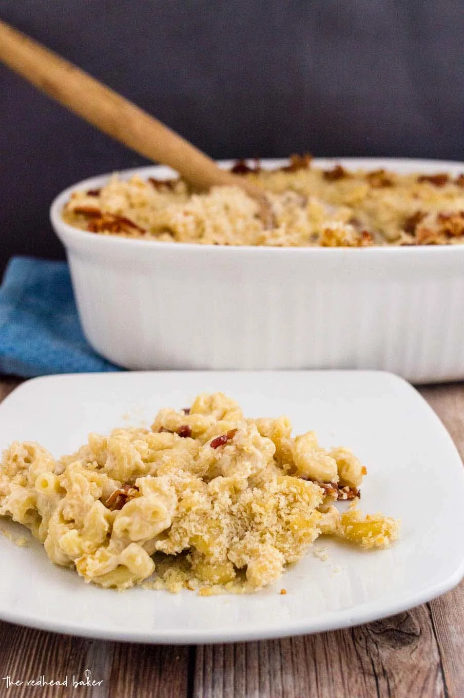 A plateful of Irish mac and cheese sitting in front of the casserole dish.