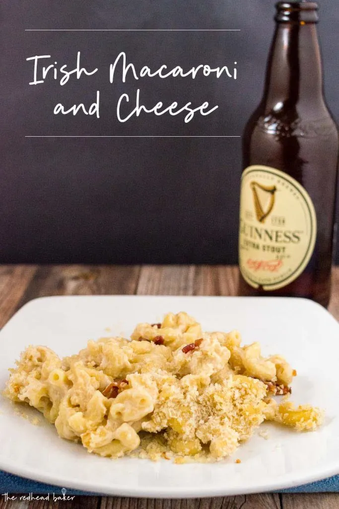 A plateful of Irish mac and cheese with a bottle of Guinness beer behind it.