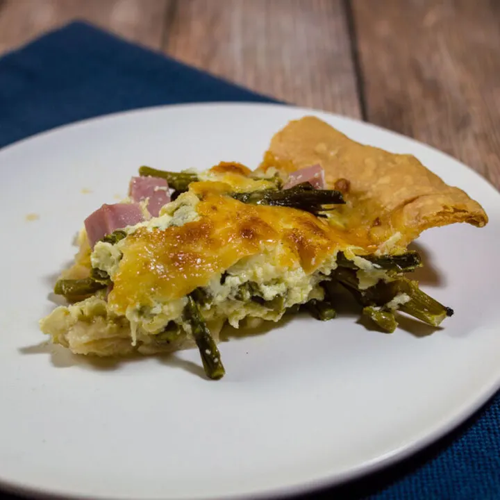 This ham, asparagus and gruyere quiche is ideal for brunch for a crowd: it should be made ahead, can be served at room temperature, and it's delicious!