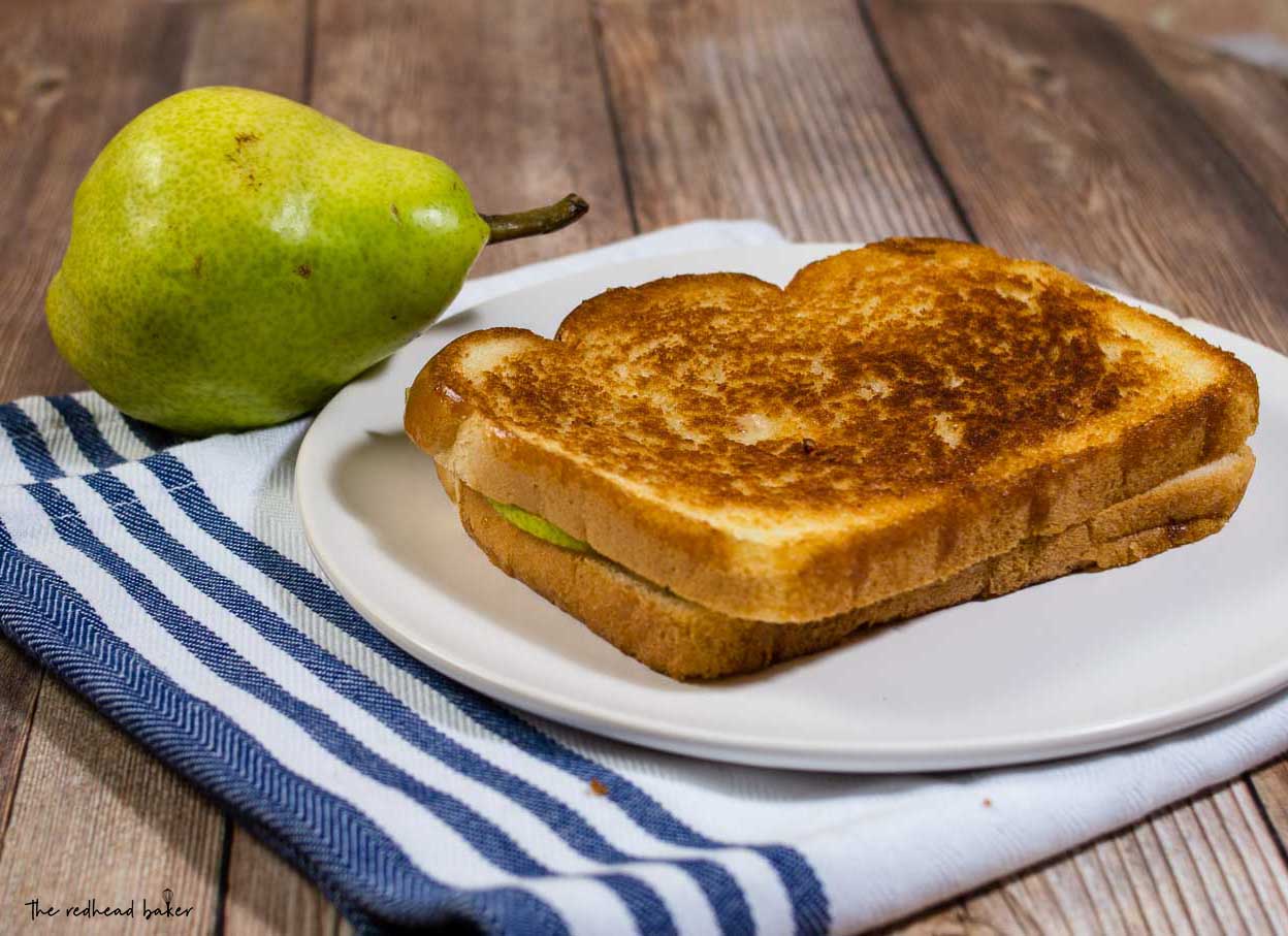 This gourmet grilled cheese sandwich with taleggio cheese and thin slices of pear is the perfect way to celebrate National Grilled Cheese Month!