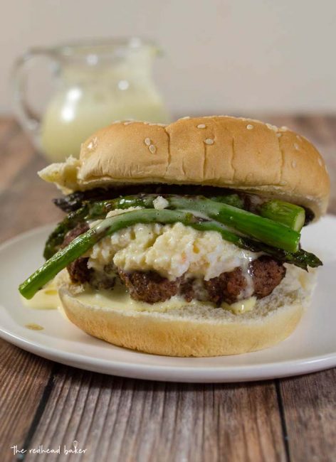 Surf-n-turf meets backyard cookout in these Oscar-Style Burgers. Hamburger patties are topped with crab meat, tender-crisp asparagus and rich Bearnaise sauce. #BurgerMonth