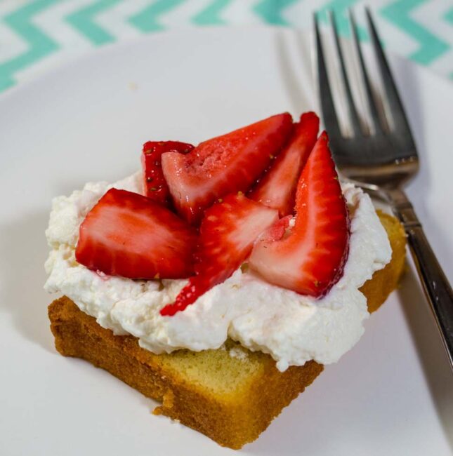 Strawberry shortcake pound cake is a slight twist on a classic. Instead of shortcakes (biscuits), I use toasted slices of pound cake topped with macerated strawberries and fresh whipped cream. #BrunchWeek