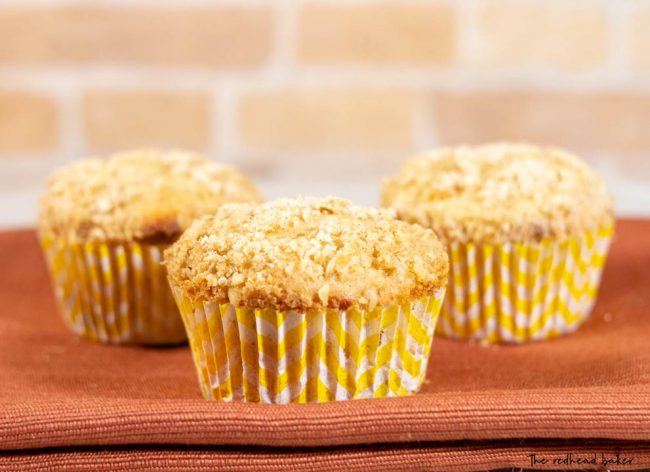 Bakery-style peach crumb muffins are fluffy, moist, and loaded with bits of fresh yellow peaches complemented with Nielsen-Massey Organic Almond Extract.