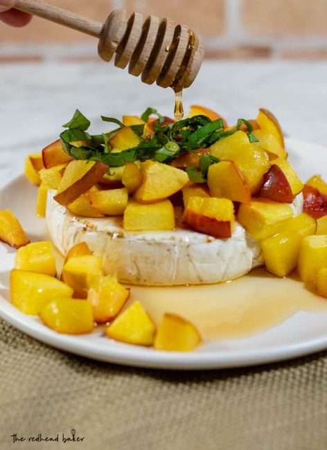 Think baked brie is only for winter holidays? Think again! Honey, basil and peach baked brie uses the freshest flavors of the summer to complement the buttery cheese. 