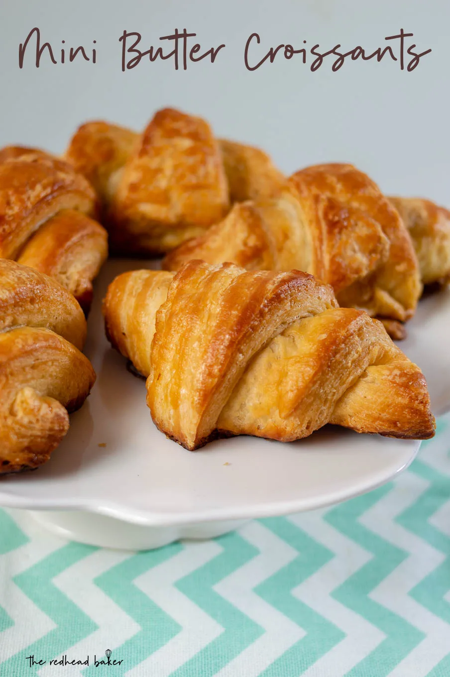 A close-up shot of a plate of mini butter croissants.