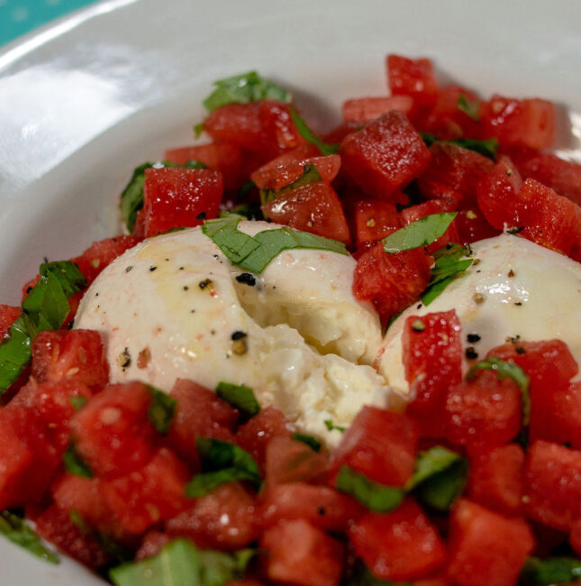 A dish of watermelon burrata salad