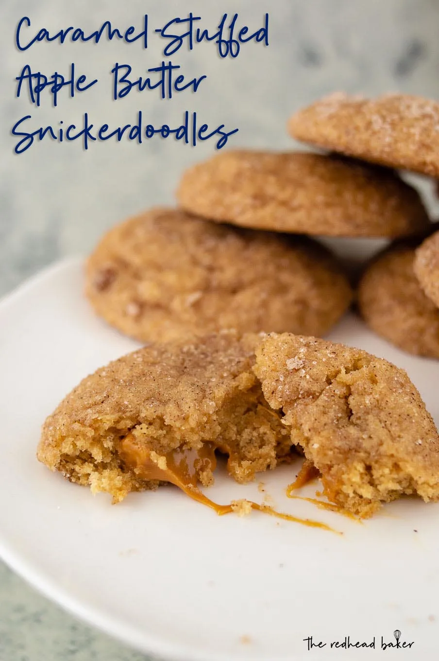 Half of a caramel-stuffed apple butter snickerdoodle with the caramel center oozing out
