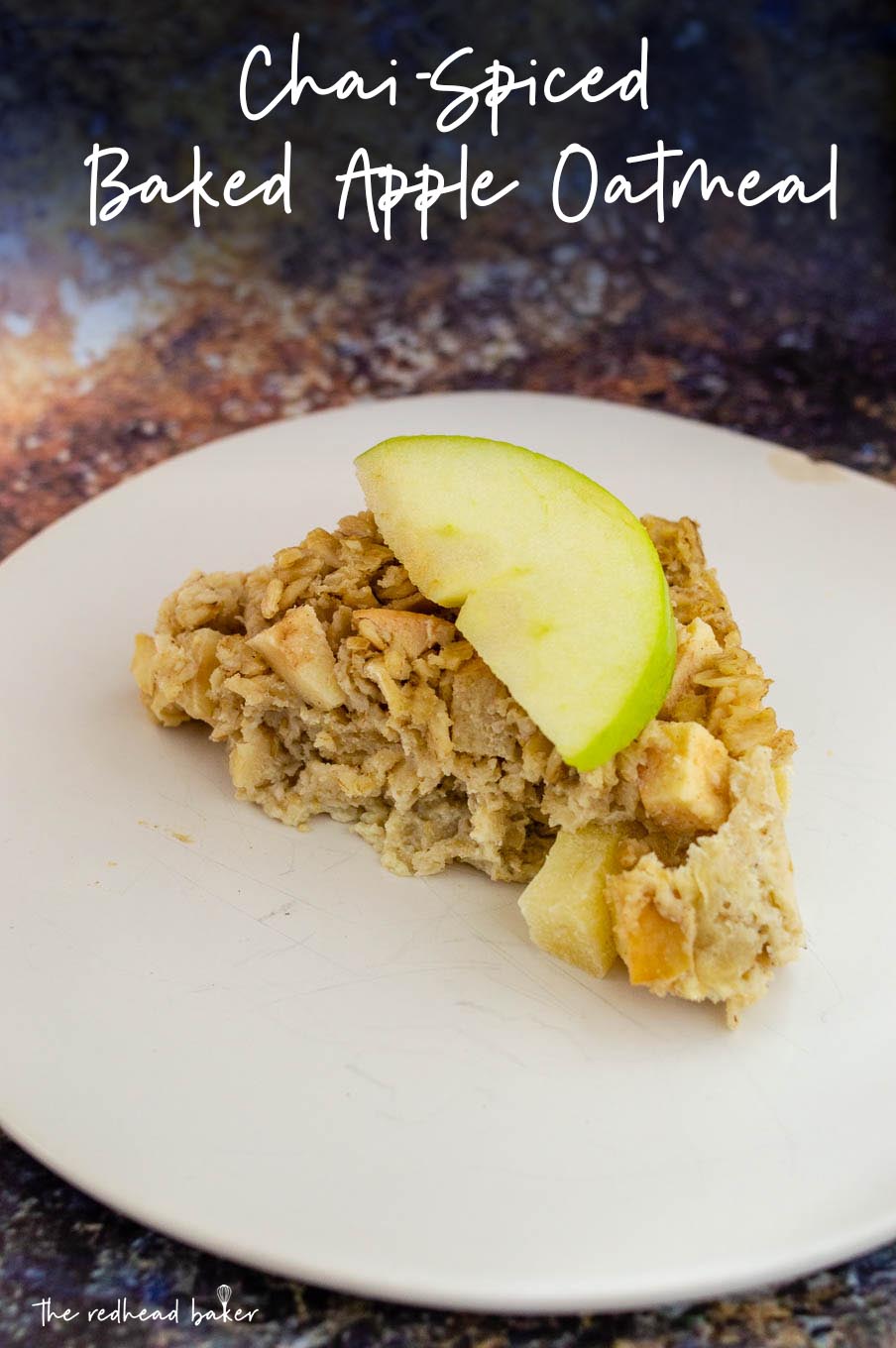A triangle of baked apple oatmeal with a fresh apple wedge on top