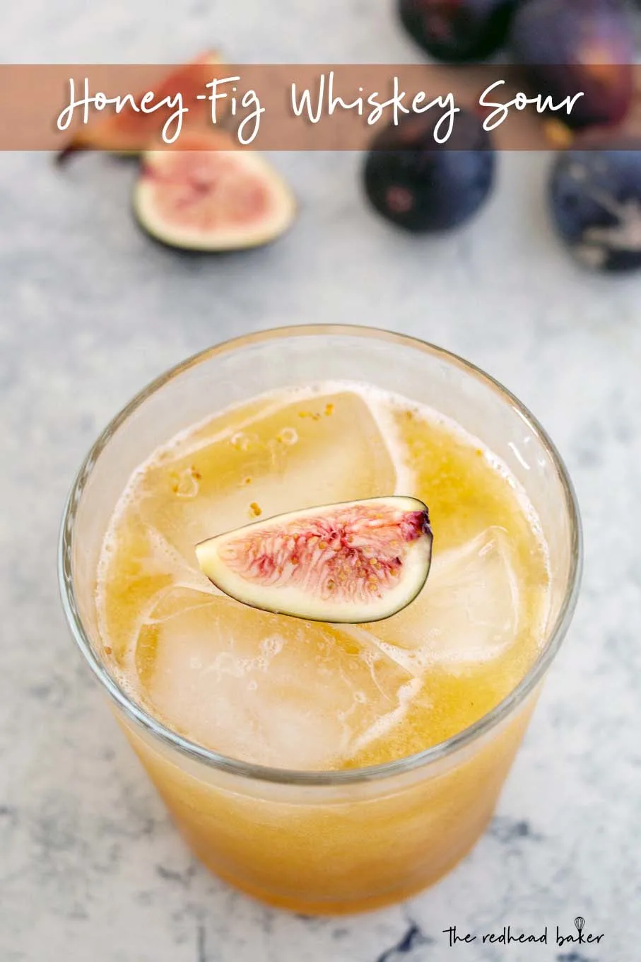 A high-angle photo of a honey-fig whiskey sour, garnished with a quarter of a fresh fig