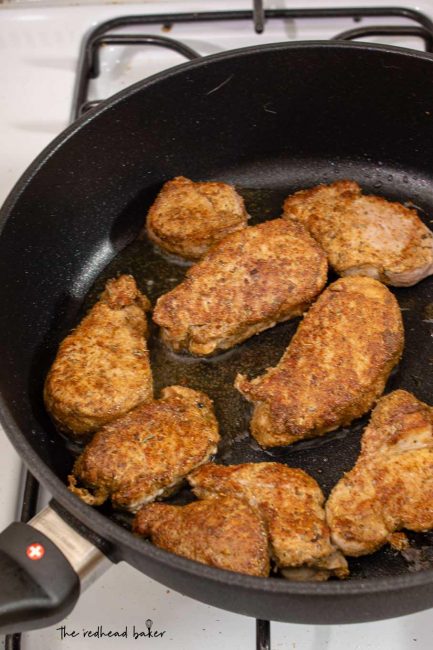 Pork tenderloin strips being cooked in a Swiss Diamond nonstick saute pan