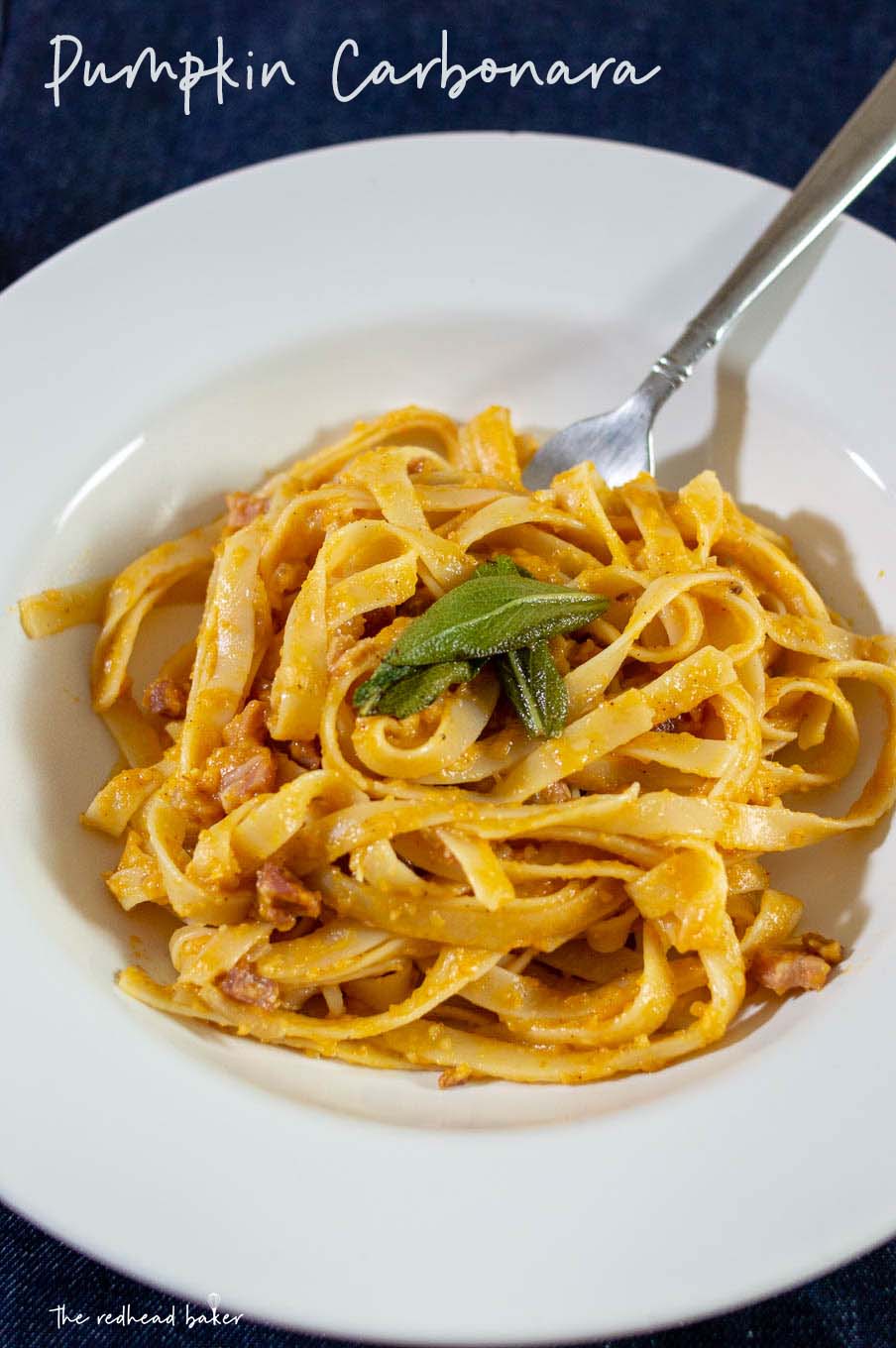 A closer shot of a serving of pumpkin carbonara in a serving dish.