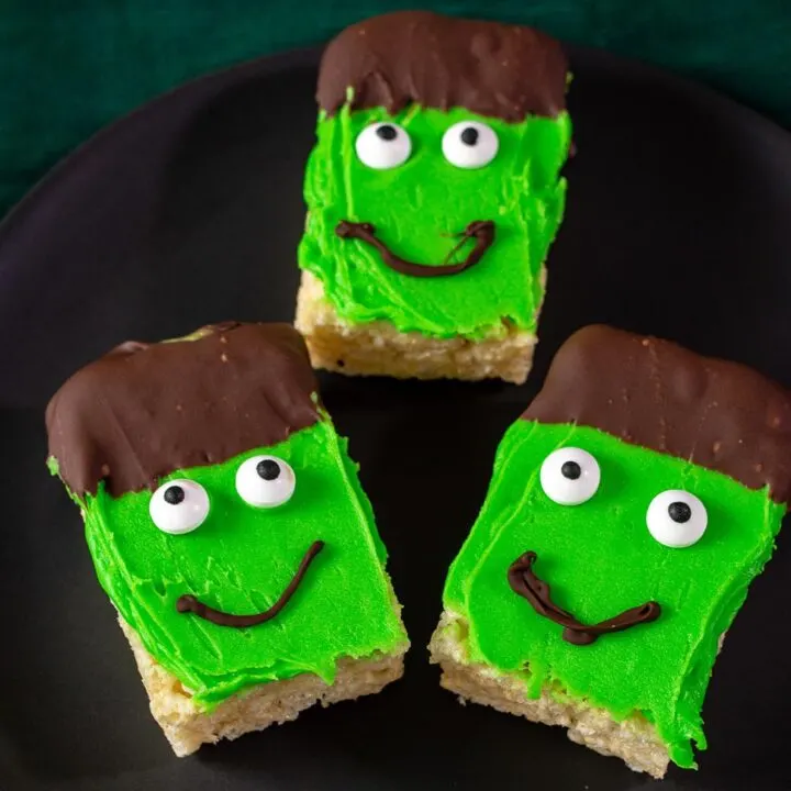 Three Frankenstein Crispy Cereal Treats on a black plate