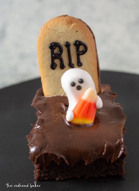 A single haunted graveyard brownie on a black plate